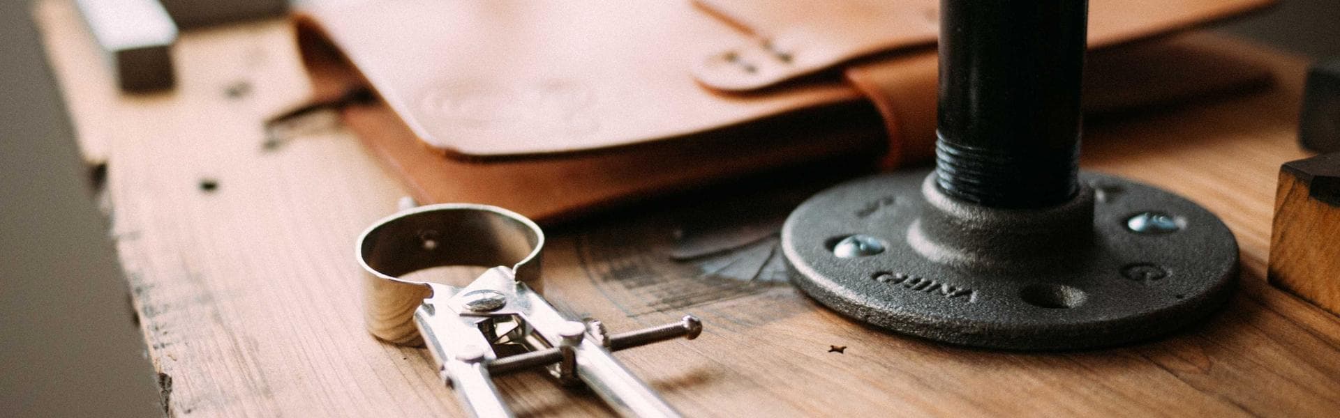 An open book with blank pages on a wooden table.